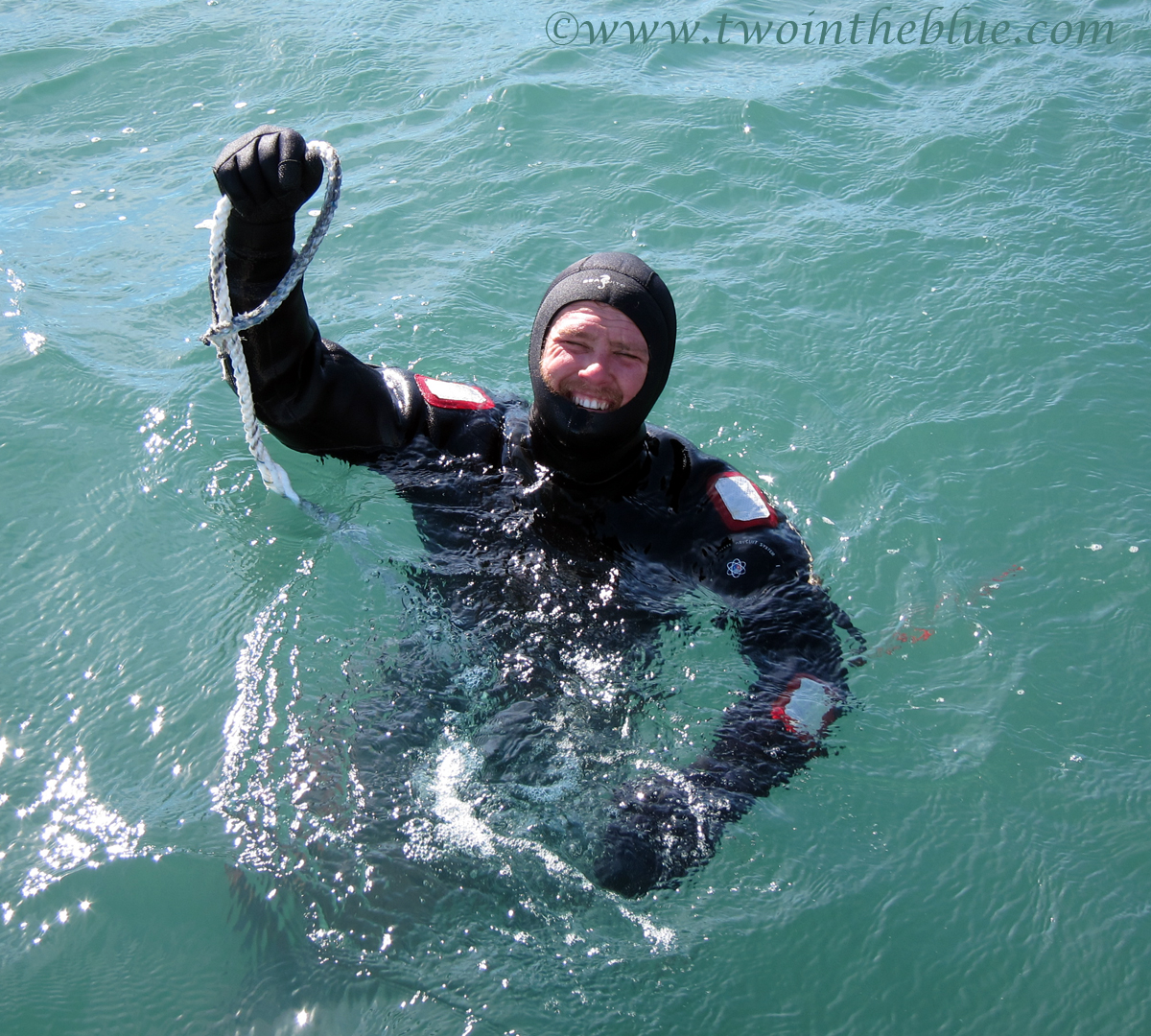 Removing a rope from the propeller two in the blue